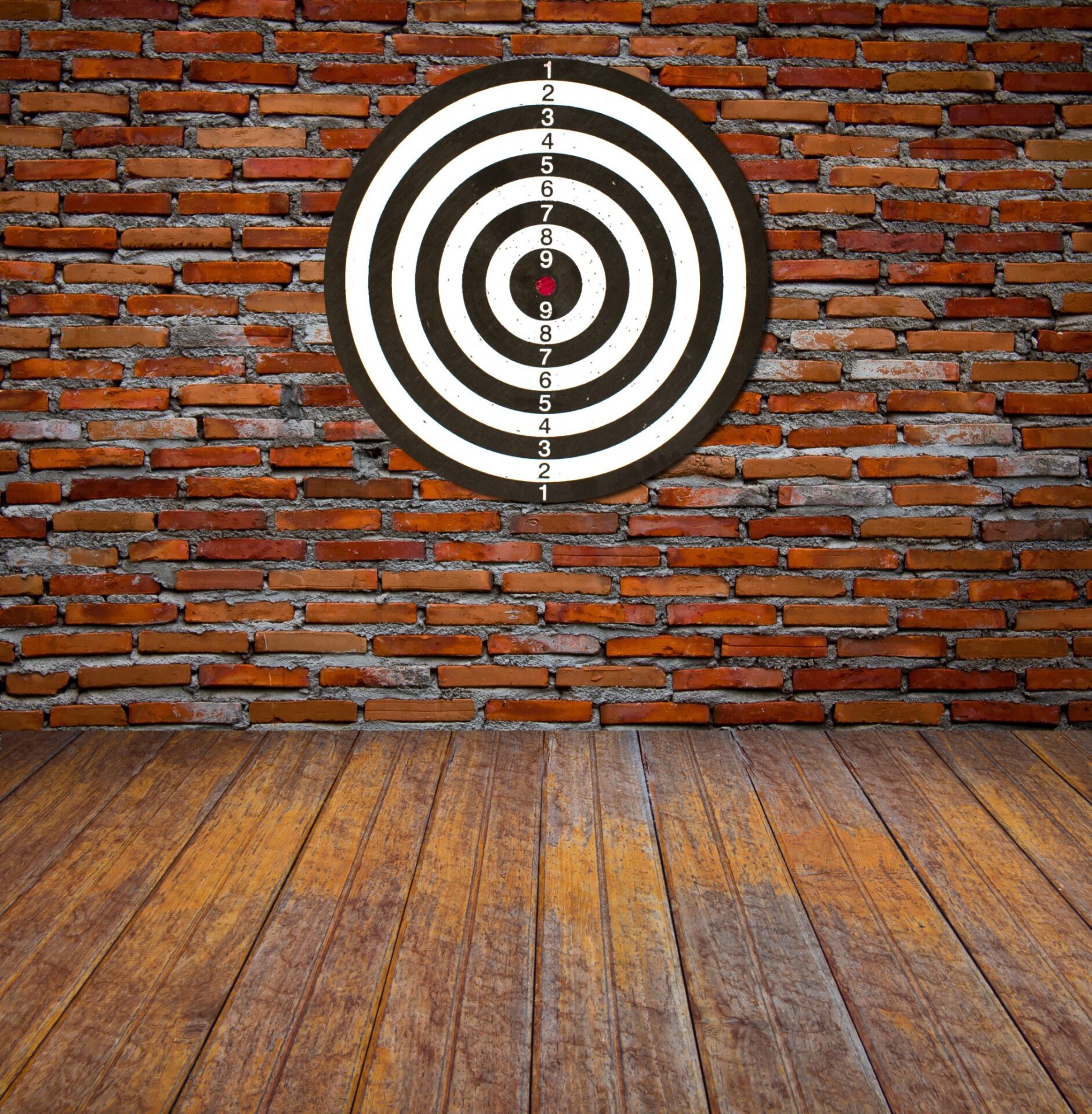 Dartboard on brick wall